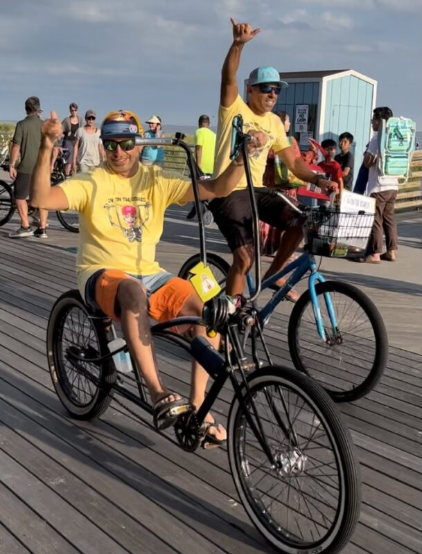 Rob Carlo riding his custom beach cruiser on the Long Beach Boardwalk.